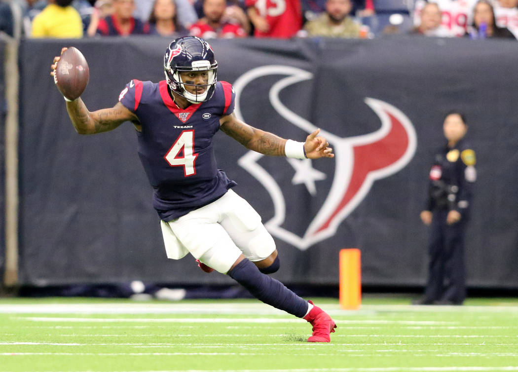 Houston Texans quarterback Deshaun Watson (4) runs with the football during the first half of a ...