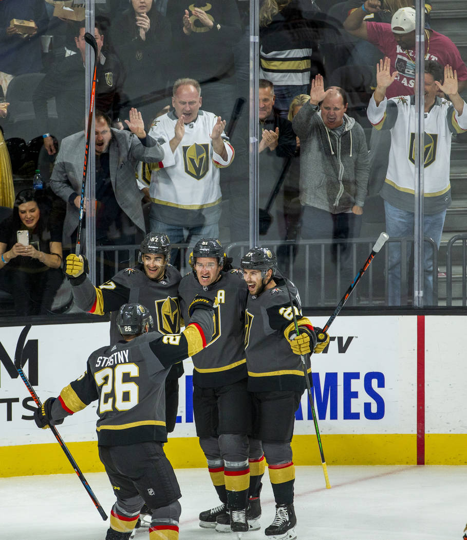 Vegas Golden Knights right wing Mark Stone (61, center) and teammates celebrate his goal over t ...