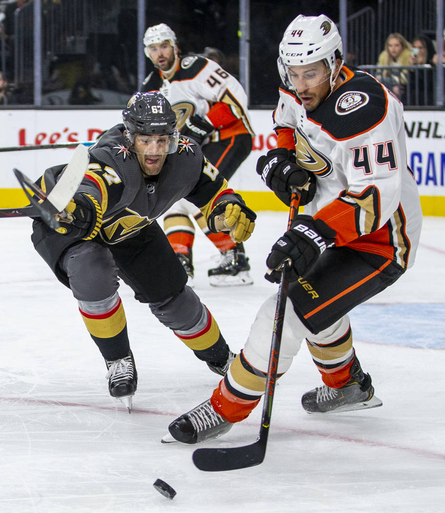 Vegas Golden Knights left wing Max Pacioretty (67) fights to get to the puck with Anaheim Ducks ...