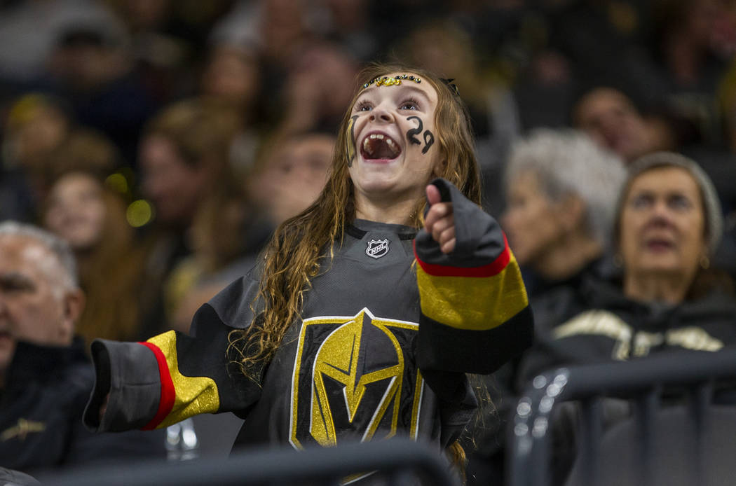A Vegas Golden Knights fan see herself on the big screen as the team faces the Anaheim Ducks du ...