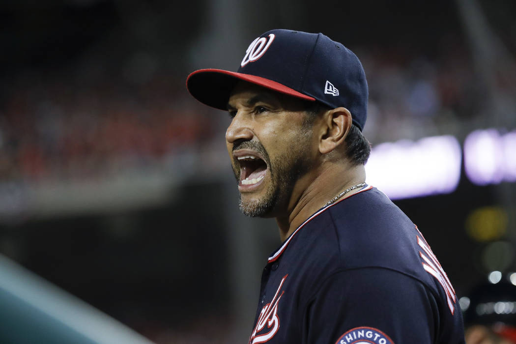 Washington Nationals manager Dave Martinez yells at the home plate umpire during the seventh in ...