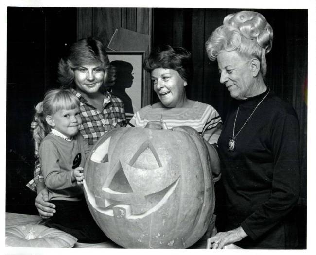 Four generations of pumpkin carvers, but only one who knows how to cheese for the camera. (Scot ...