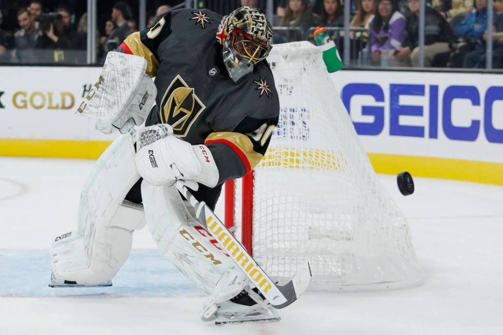 Vegas Golden Knights goaltender Malcolm Subban knocks the puck away during the first period of ...