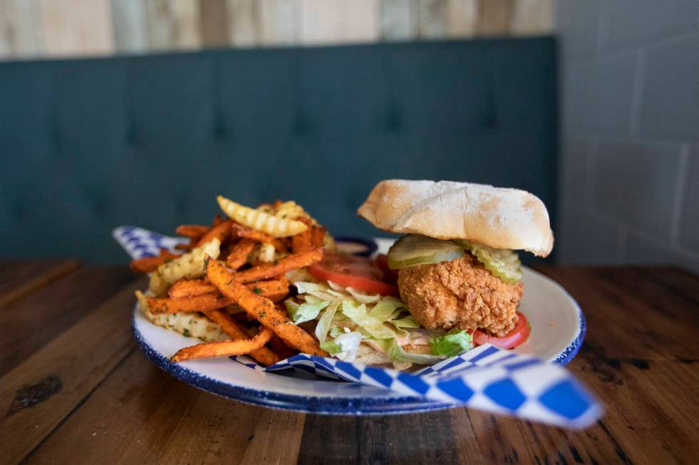 Mama Bird's fried chicken sandwich sits high on a potato roll at the restaurant on Friday, Oct. ...