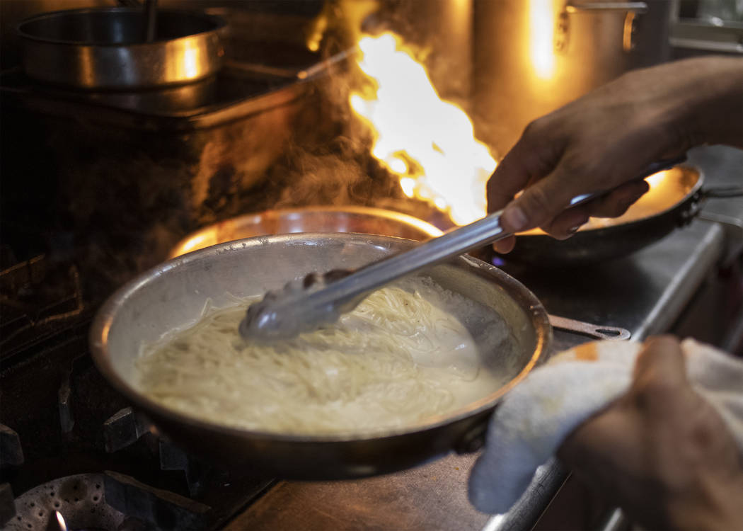 Spaghetty Western chefs dole out classic pasta dishes from the kitchen on Friday, Oct. 25, 2019 ...