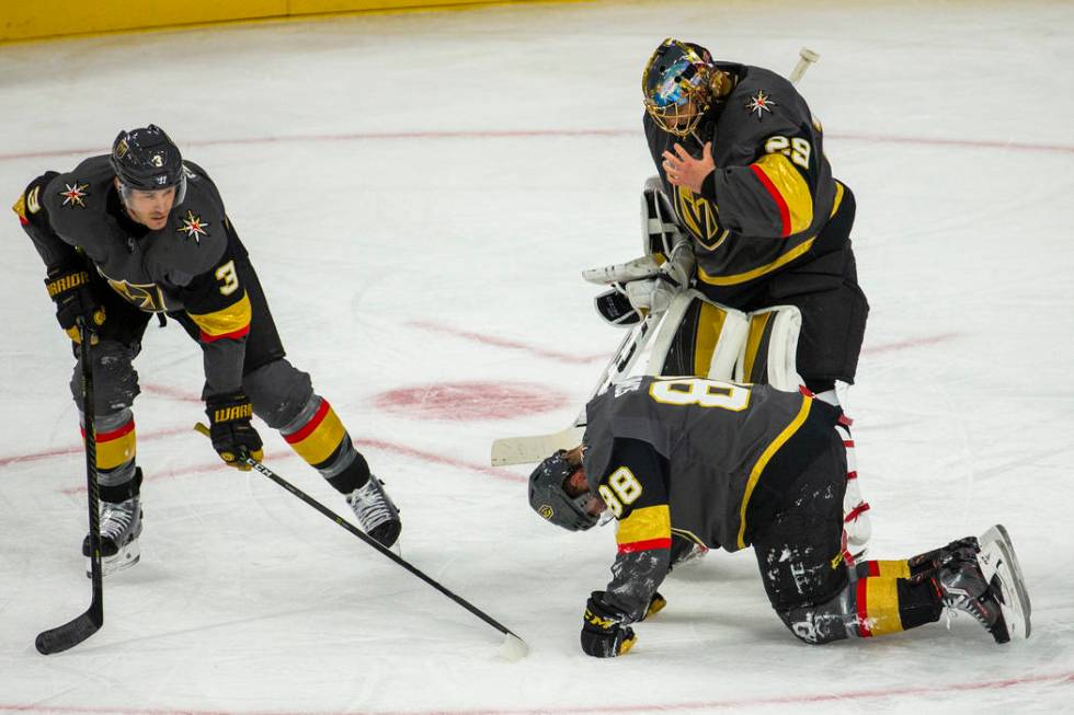 Vegas Golden Knights defenseman Nate Schmidt (88) is down injured on the ice versus the San Jos ...