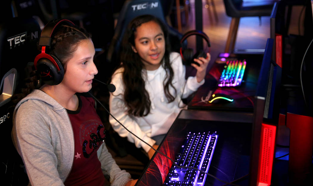 Eighth graders Sarahie Quinonez, left, and Alexa Martinez, both 13, play esports during Battle ...