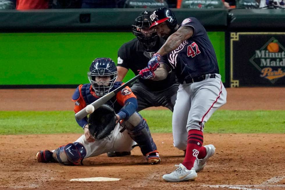 Washington Nationals' Howie Kendrick hits a two-run home run against the Houston Astros during ...