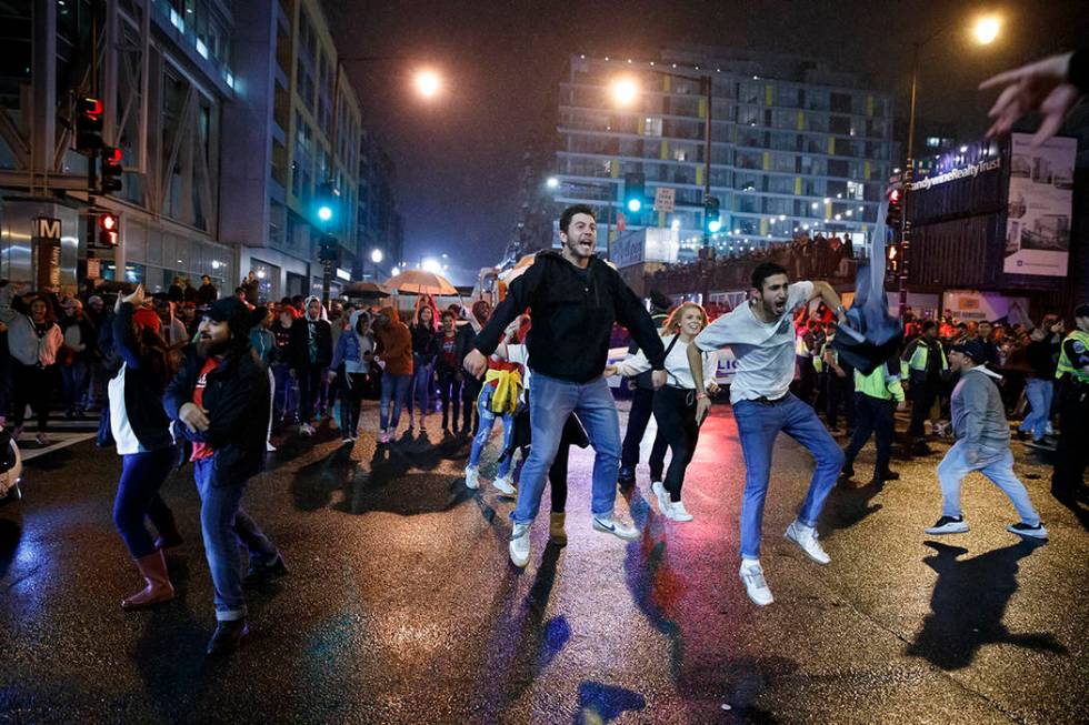 Washington Nationals fans celebrate early Thursday, Oct. 31, 2019, in Washington after the Wash ...