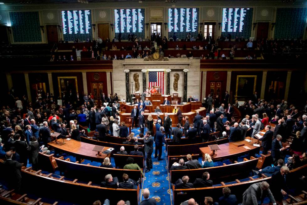 Vote Tallies are displayed as House members vote on a resolution on impeachment procedure to mo ...