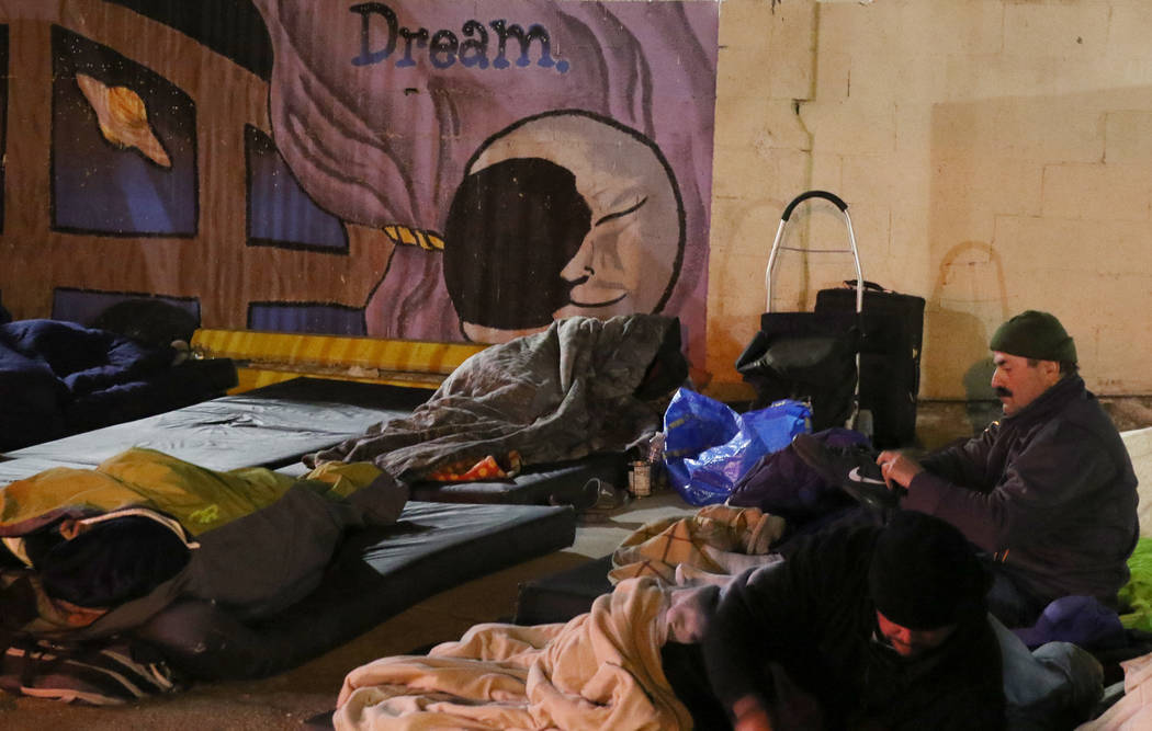 Clients sleep at Courtyard Homeless Resource Center on Thursday, Oct. 31, 2019, in Las Vegas. ( ...