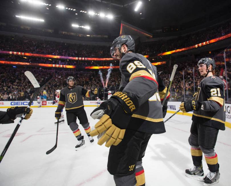 Vegas Golden Knights right wing Alex Tuch (89) celebrates his first period goal with Vegas Gold ...