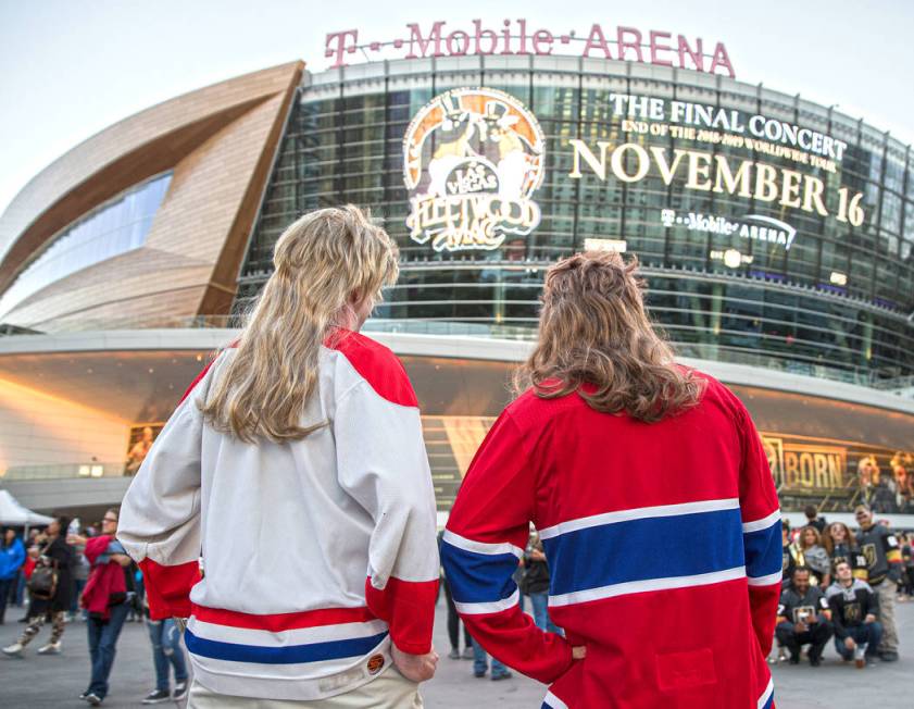 David Mayhew, right, and Michael Campbell in their Halloween outfits outside T-Mobile Arena bef ...