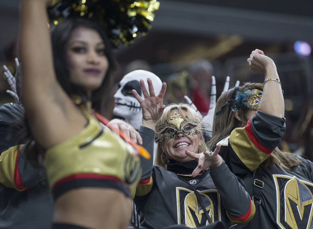 Vegas fans dress up for Halloween at T-Mobile Arena during the Golden Knights NHL hockey game w ...