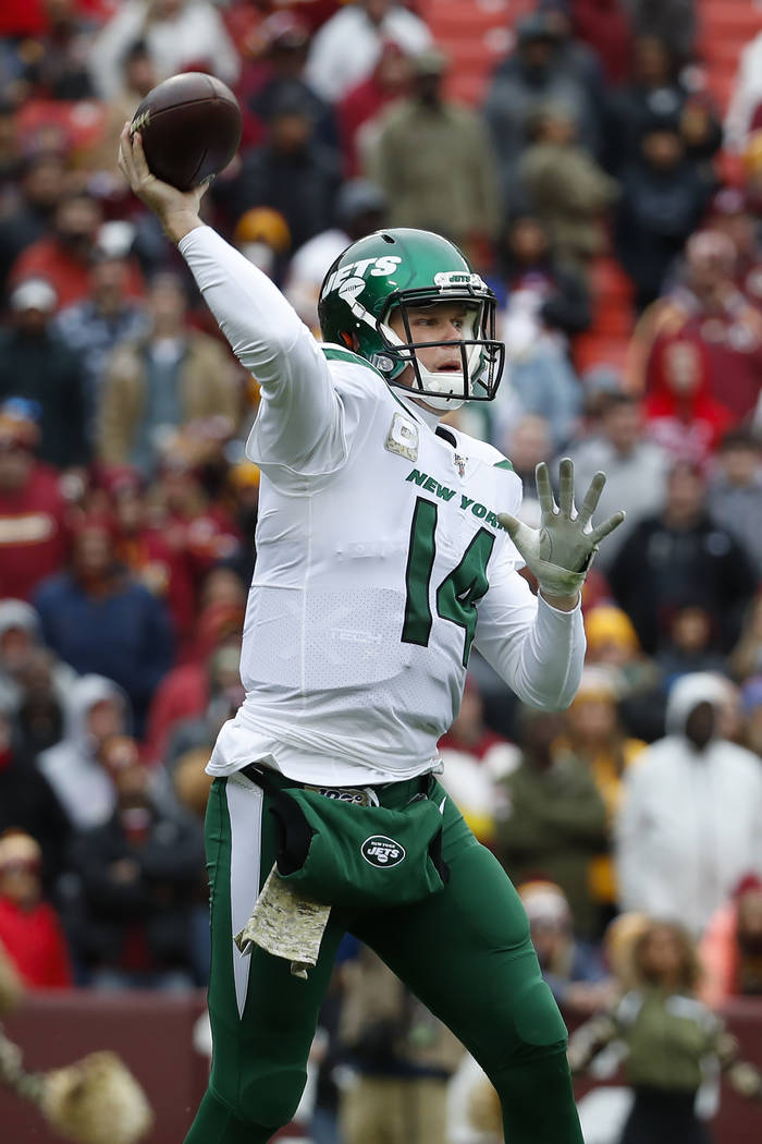 New York Jets quarterback Sam Darnold (14) pass the ball during the first half of an NFL footba ...