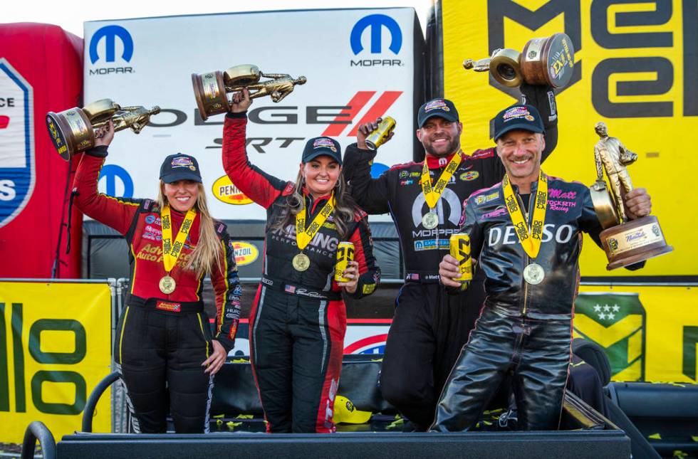 (From left) Race winners Brittany Force, Erica Enders, Matt Hagan and Matt Smith celebrate hold ...