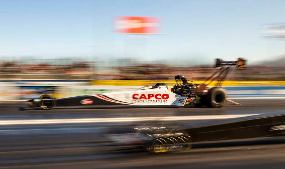 Top Fuel racer Steve Torrence surges ahead during the second round of the Dodge NHRA Nationals ...