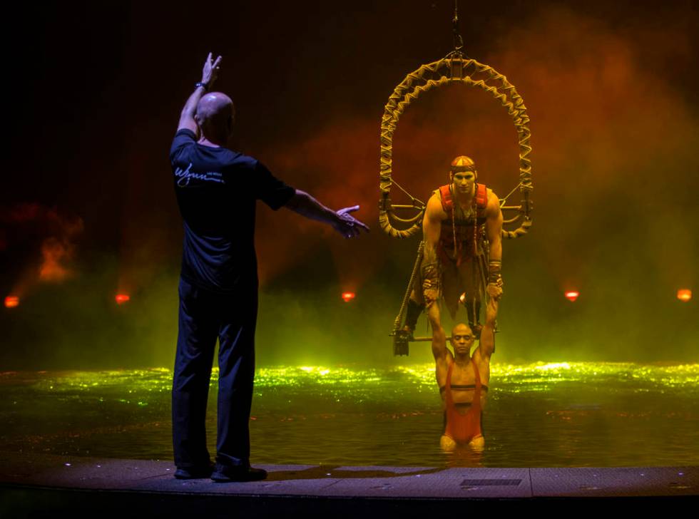 Aerial conceptor, coach and performer Didier Antoine, left, gives direction to Ryan Bartlett, t ...