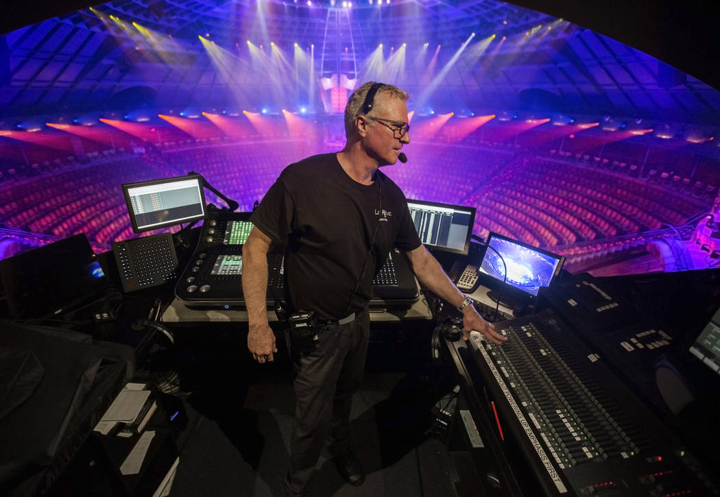Assistant head of lighting Tracer Finn makes adjustments to show lights during rehearsal for &q ...