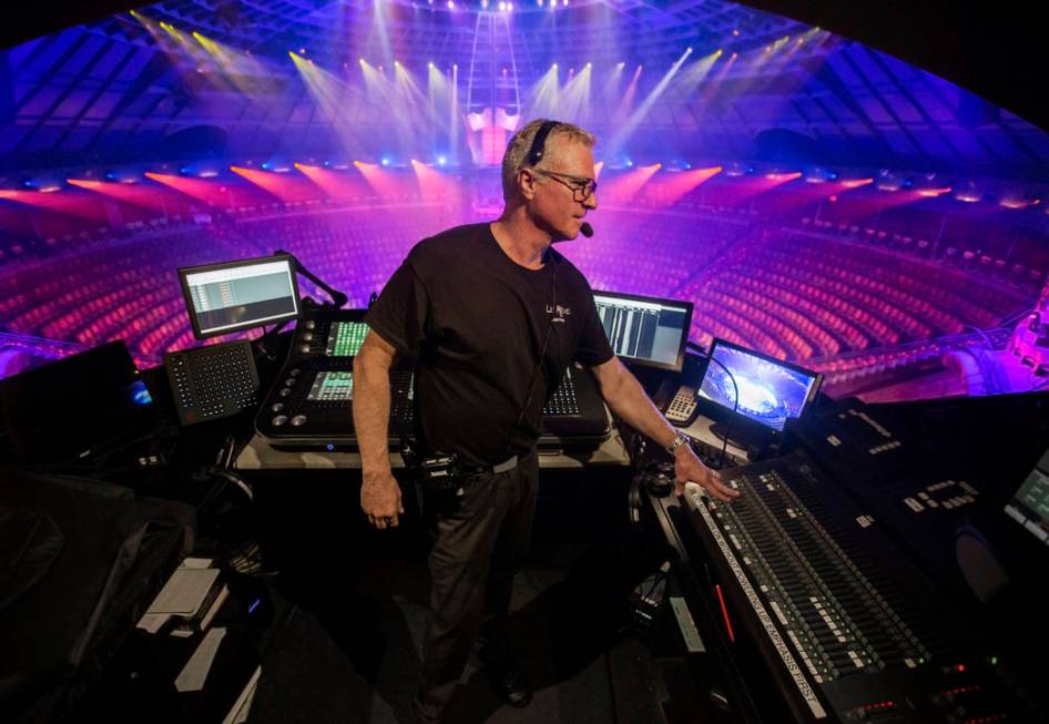 Assistant head of lighting Tracer Finn makes adjustments to show lights during rehearsal for &q ...