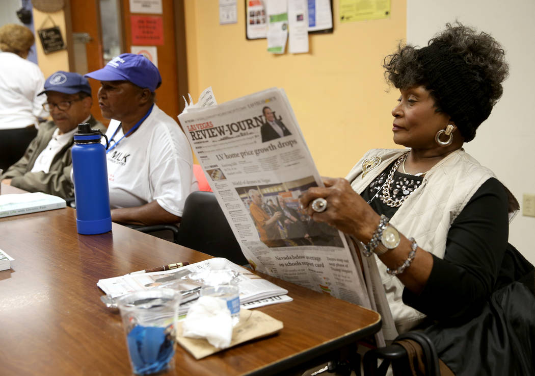 Ada Glover, 76, reads the paper at Martin Luther King Jr. Senior Center in North Las Vegas Wedn ...