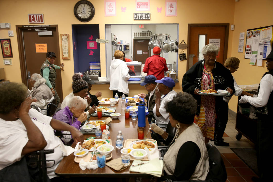 Senior crowd into the lunchroom at Martin Luther King Jr. Senior Center in North Las Vegas Wedn ...