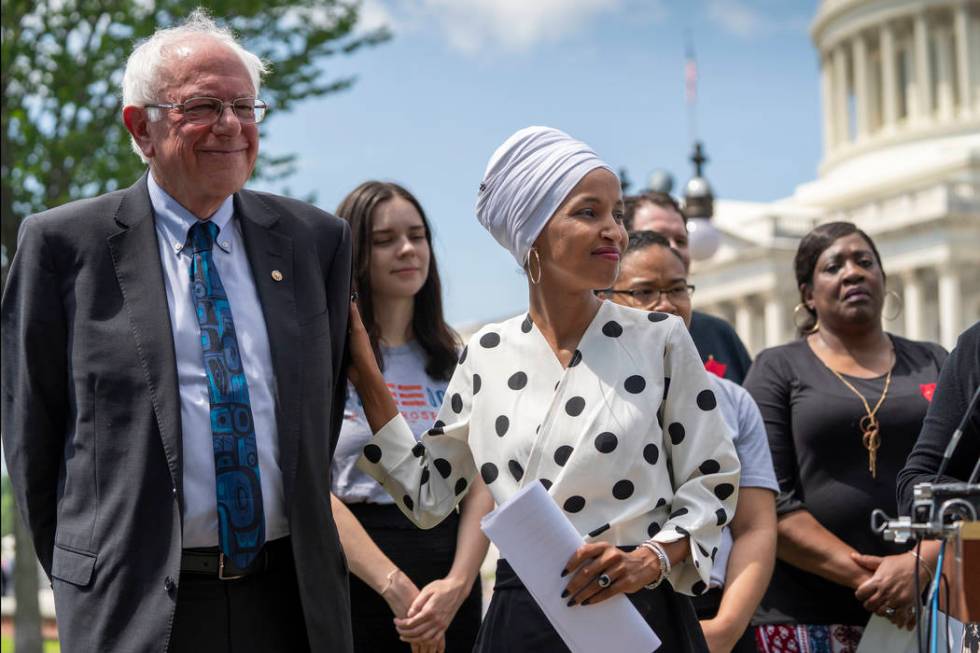 Democratic presidential candidate, Sen. Bernie Sanders, I-Vt., left, and Rep. Ilhan Omar, D-Min ...