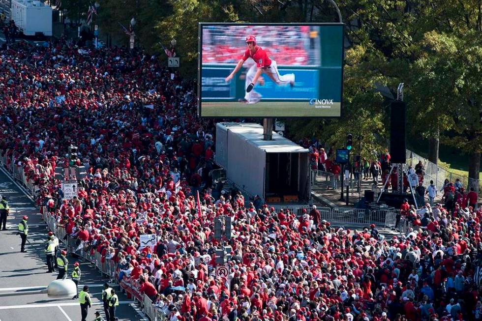 Fans wait for the MLB Washington Nationals to celebrate the team's World Series baseball champi ...