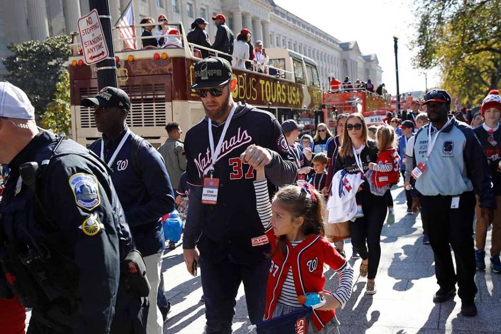 Washington Nationals starting pitcher Stephen Strasburg (37) arrives for a parade to celebrate ...