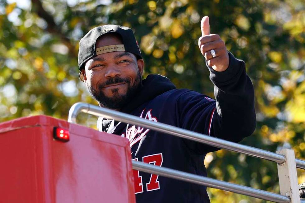 Washington Nationals second baseman Howie Kendrick gestures to fans before a parade to celebrat ...