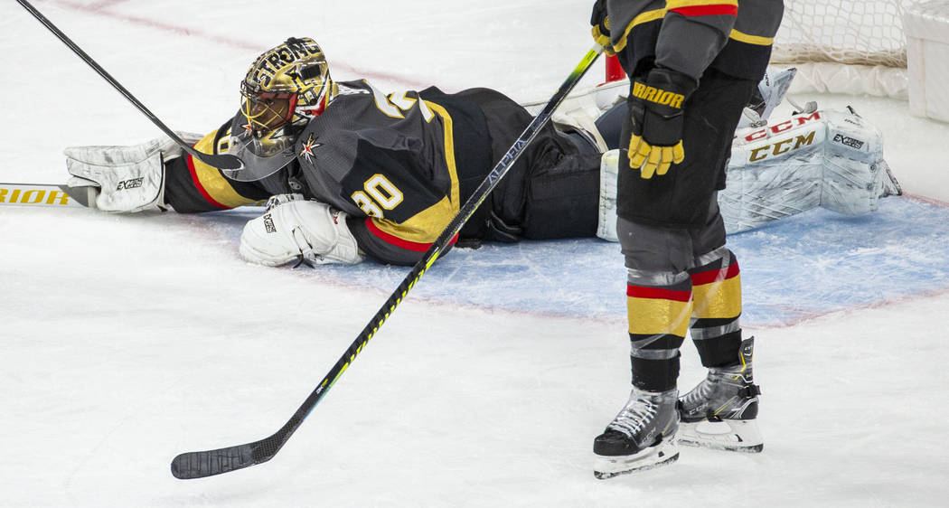 Vegas Golden Knights goaltender Malcolm Subban (30) dives onto a loose puck versus the Winnipeg ...