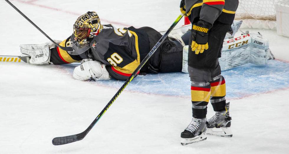 Vegas Golden Knights goaltender Malcolm Subban (30) dives onto a loose puck versus the Winnipeg ...