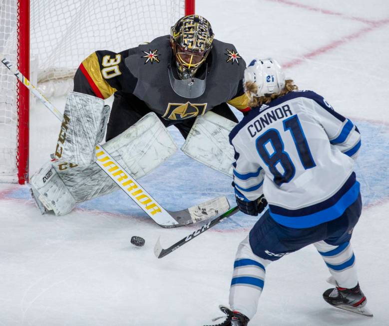 Vegas Golden Knights goaltender Malcolm Subban (30) has a shot from Winnipeg Jets left wing Kyl ...