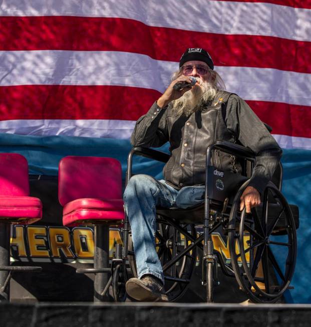 Daniel "Lt. Dan" Holman sings the National Anthem during the 10th Annual One Hero at ...
