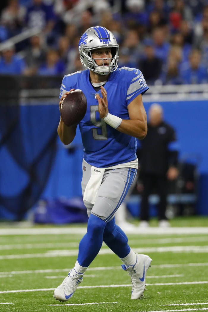 Detroit Lions quarterback Matthew Stafford throws against the New York Giants during an NFL foo ...