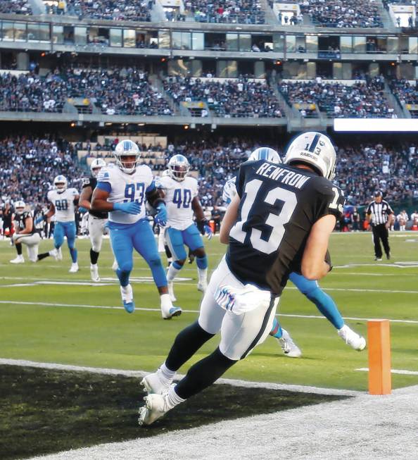 Oakland Raiders wide receiver Hunter Renfrow (13) catches a touchdown pass against the Detroit ...