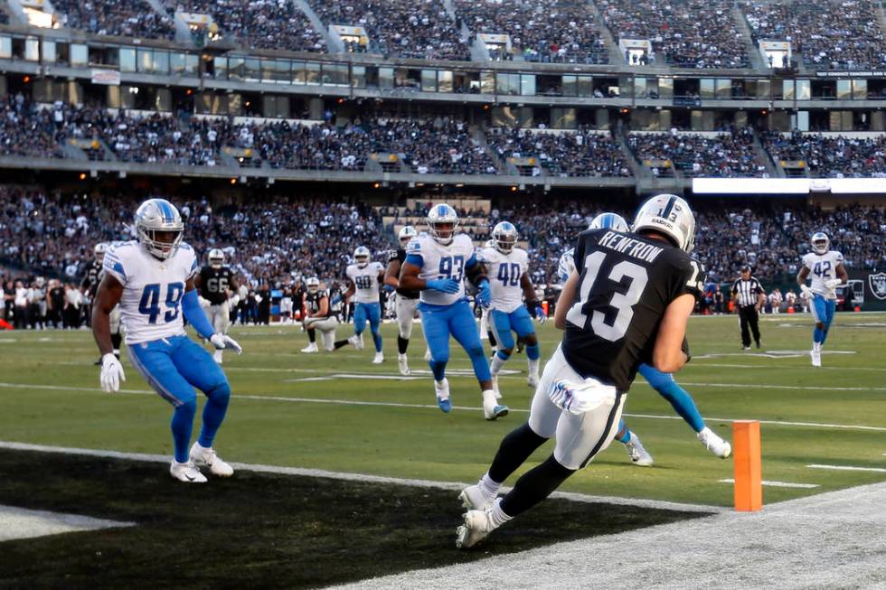 Oakland Raiders wide receiver Hunter Renfrow (13) catches a touchdown pass against the Detroit ...