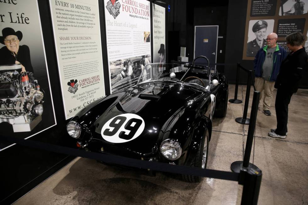 Ray and Barb Crawford of Rochester, N.Y., check out a reproduction of the 1964 Cobra FIA compet ...