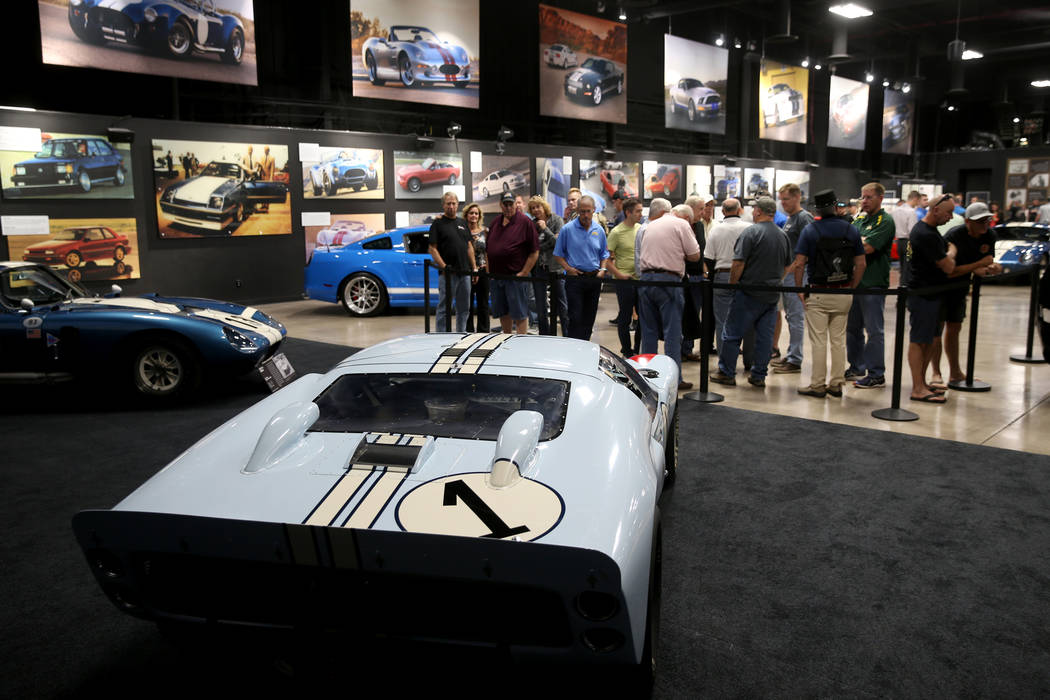 Guests check out Carroll Shelby's 1966 Ford Mark II at the Shelby Heritage Center in Las Vegas ...