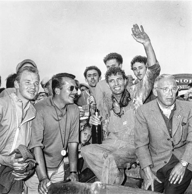 Race car driver Carroll Shelby, of Dallas, Texas, is surrounded by fans after winning the 24-ho ...