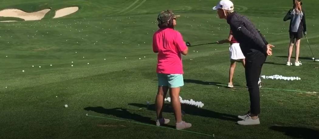 Annika Sorenstam shares a swing tip with a Southern Nevada junior golfer during her "Share My P ...