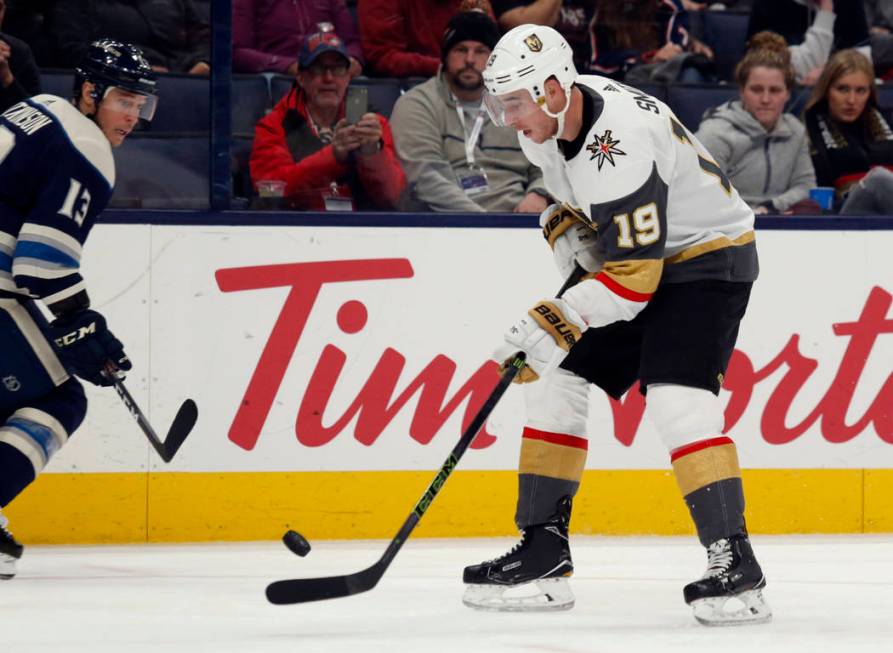 Vegas Golden Knights forward Reilly Smith, right, controls the puck in front of Columbus Blue J ...