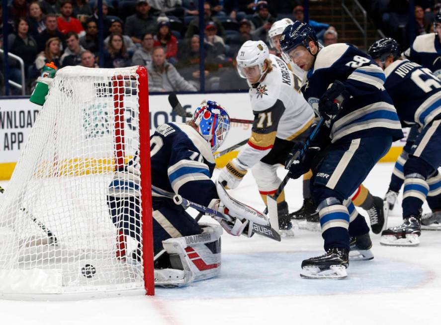 Vegas Golden Knights forward William Karlsson, center, of Sweden, watches forward Reilly Smith' ...