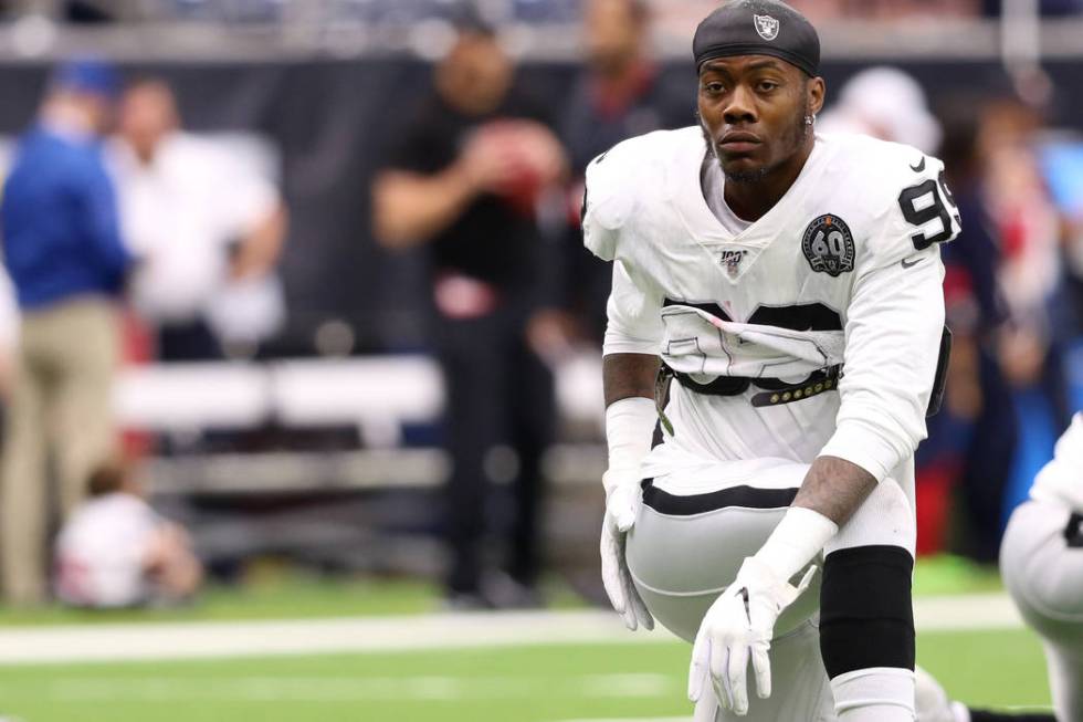 Oakland Raiders defensive end Arden Key (99) stretches before an NFL game against the Houston T ...