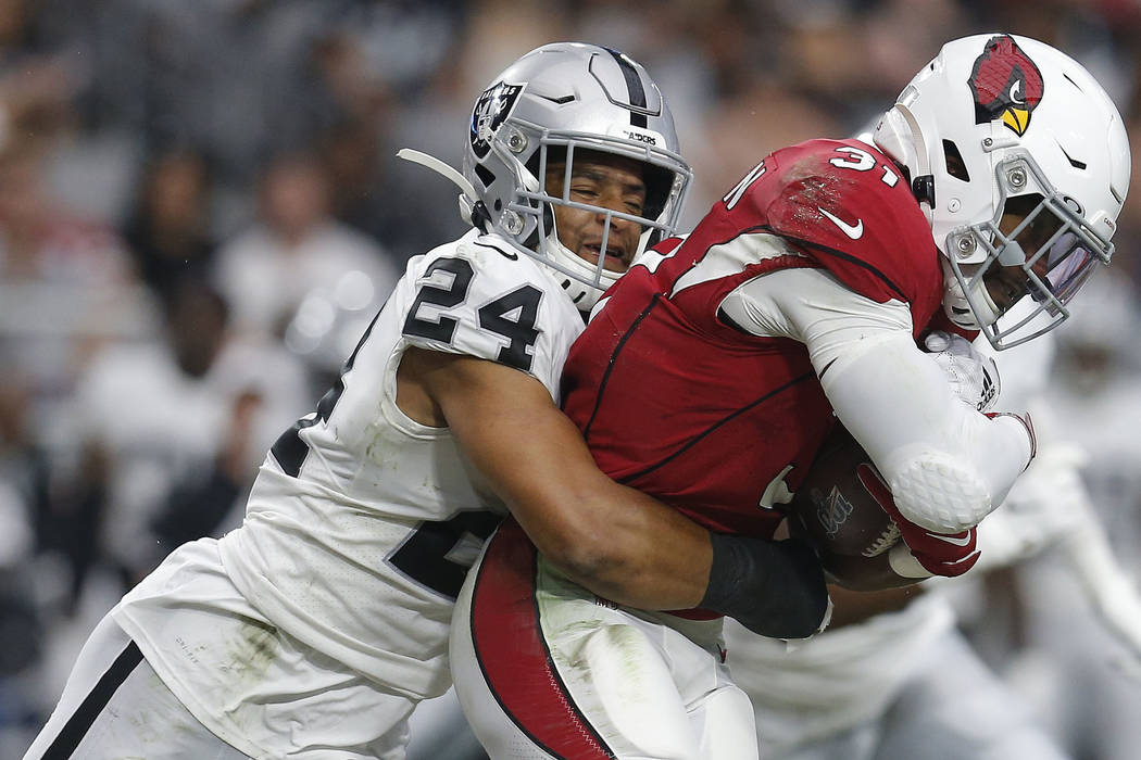 Oakland Raiders defensive back Johnathan Abram (24) tackles Arizona Cardinals running back Davi ...