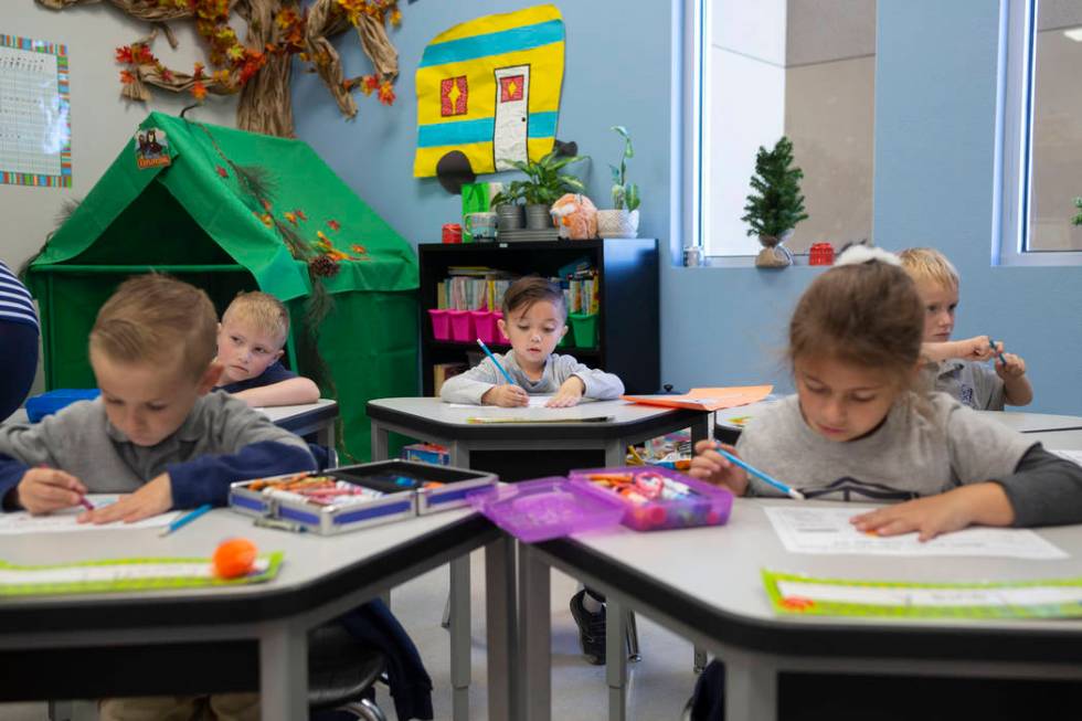 Kindergarten students work on a reading assignment at Pinecrest Academy, Nevada's newest campus ...