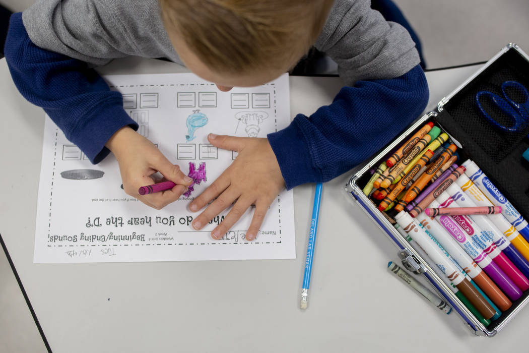 A kindergarten student works on a reading assignment at Pinecrest Academy, Nevada's newest camp ...