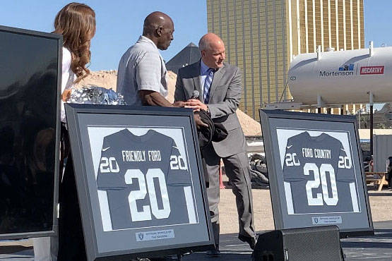 Raiders President Marc Badain, right, is joined former Raiders lineman Reggie Kinlaw and member ...