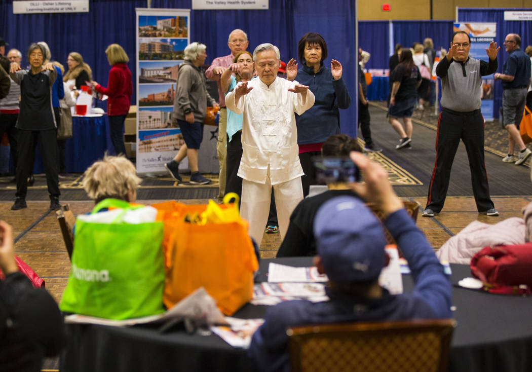 David Ou-Yang leads a beginners session in tai chi and qigong during the fifth annual AgeWell E ...