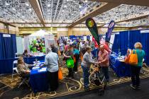 Attendees roam the show floor during the fifth annual AgeWell Expo at the Rio Convention Center ...